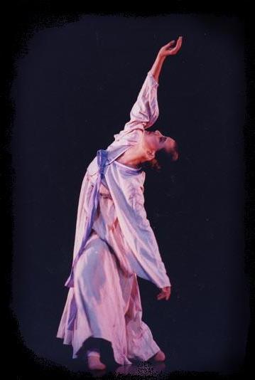 Artistic director Jun Lu performing on stage